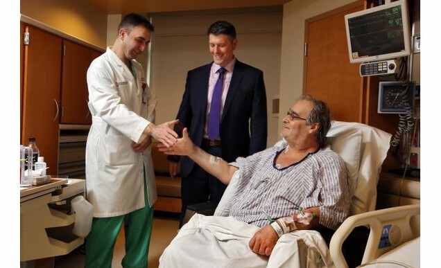 Scott Hamilton visits with members of surgical team Dr. Ashraf El-Hinnawi and Dr. Bryan Whitson (center) who performed the lung-kidney transplant.